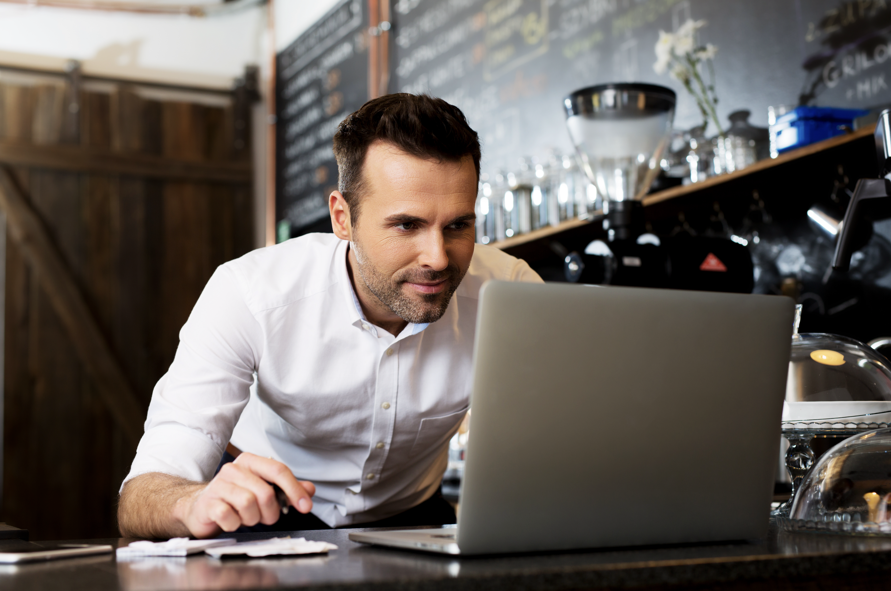 A restaurant owner using an online menu maker